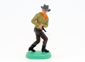 Cowboy auf Bodenplatte von 1975. Cowboy mit Colt