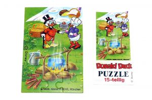 Puzzleecke unten links mit Beipackzettel von Donald Duck und Familie