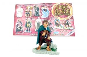 Frodo mit Beipackzettel und Tritt von Der Herr der Ringe Teil 2