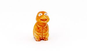 Alte Karikaturschildkröte in orange, sitzend (Alte Tierfiguren)