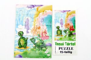 Puzzleecke oben rechts der Tapsi Törtels mit Beipackzettel (15 Teile Puzzle)